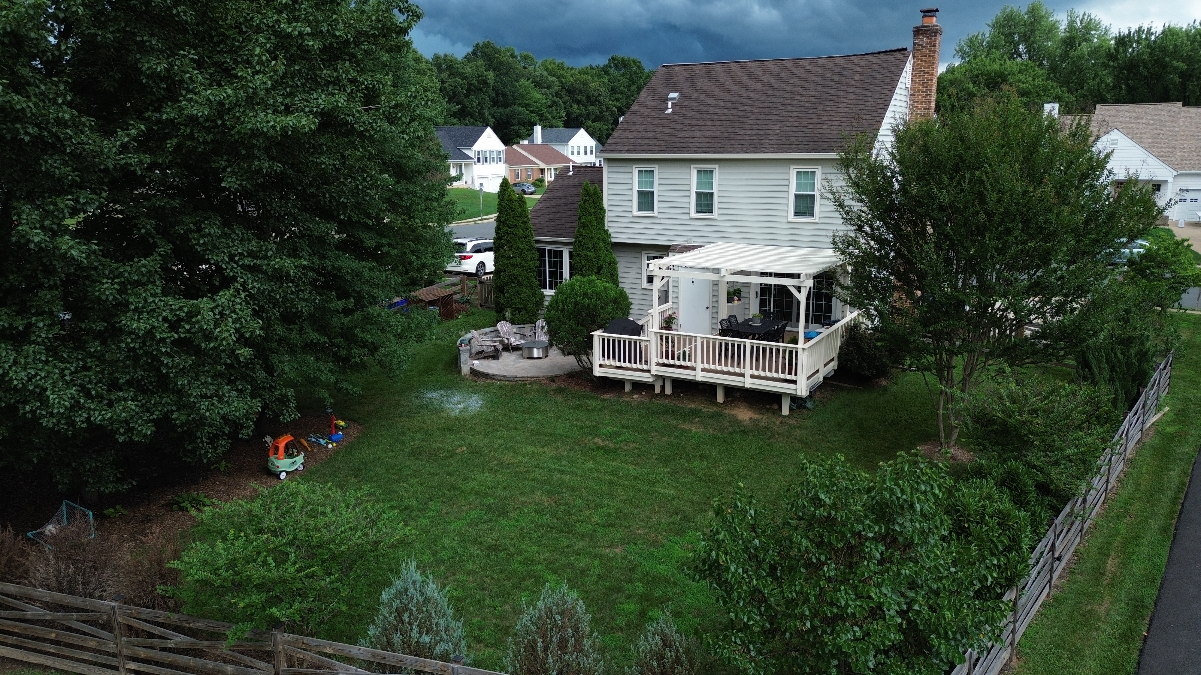 Aerial view of Northern Virginia home with deck and pergola