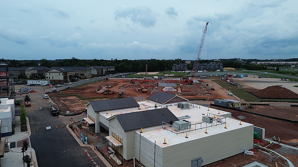 Aerial construction site overview showing active development with crane in Northern Virginia