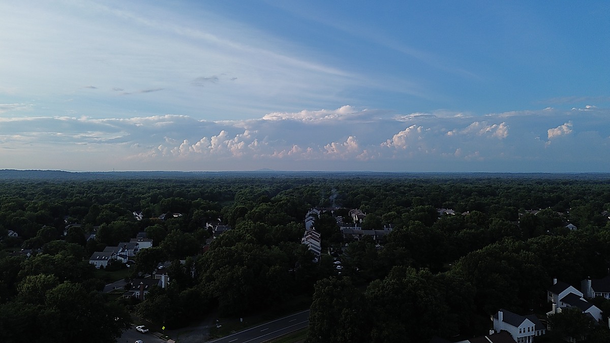 Aerial evening view over Northern Virginia neighborhood with summer skies